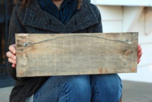 Back side of engraved limestone Welcome sign